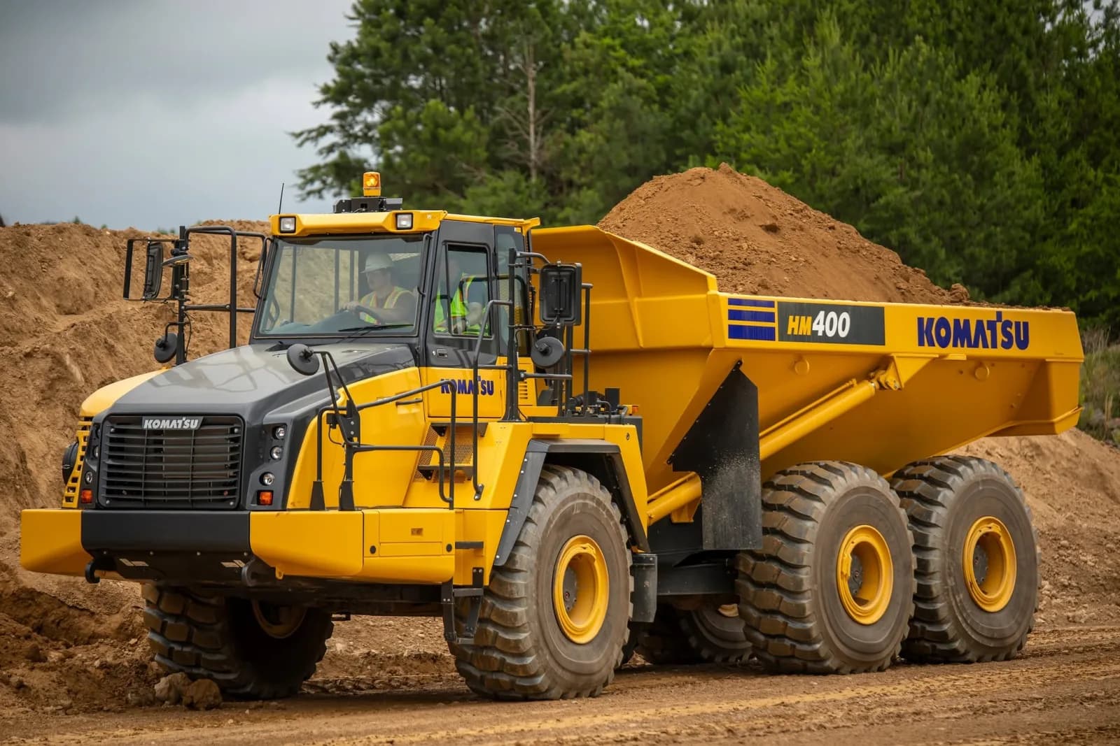 Articulated dump truck hauling