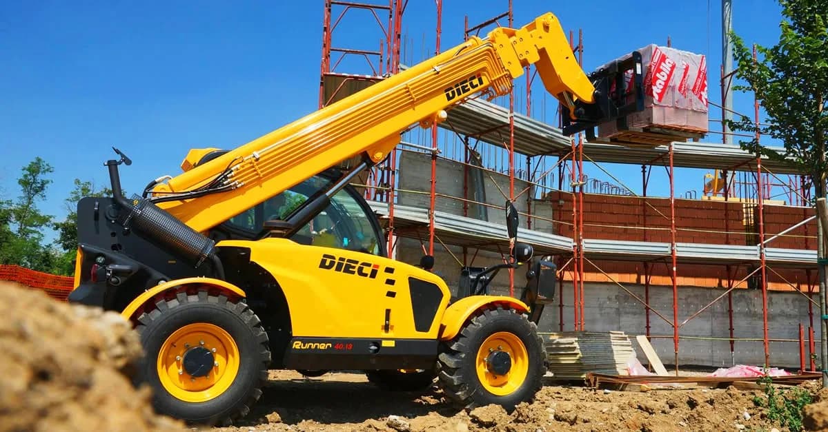 Telehandler lifting a load on site